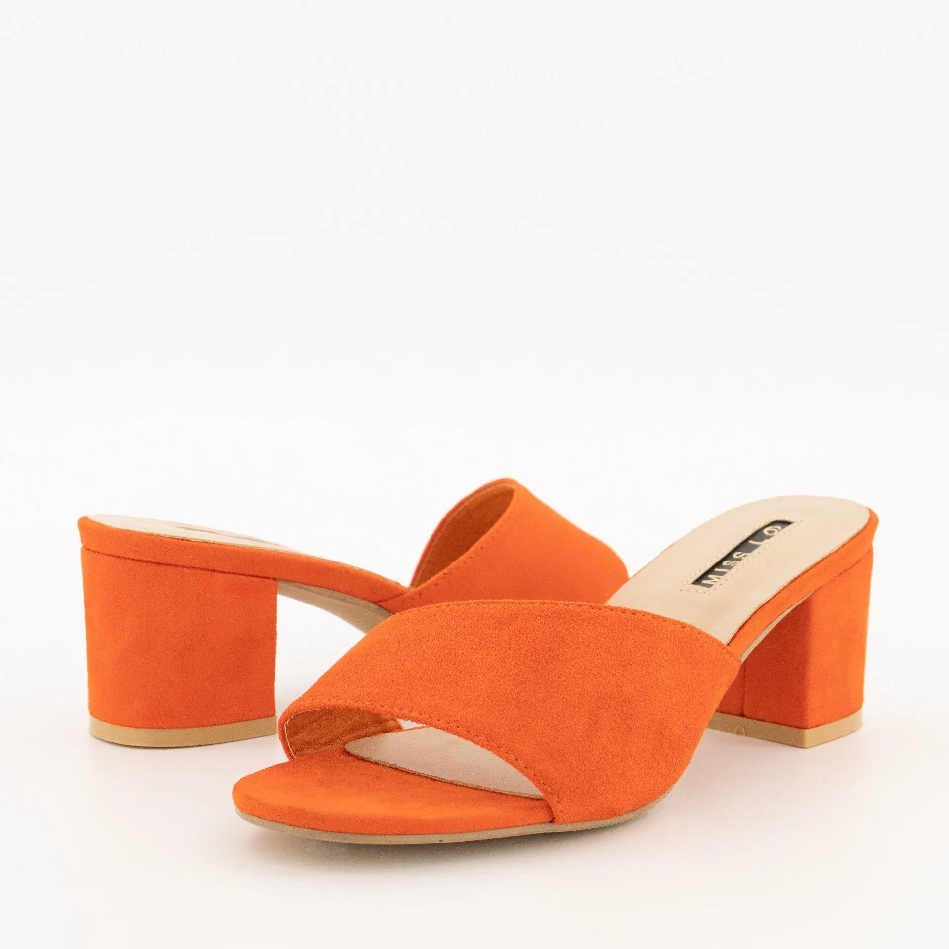 Ladies-Asymmetrical Push-In Mule On Low Block Heel